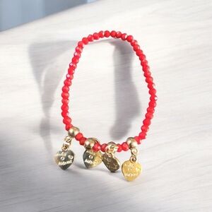 Red bead and Gold charm bracelet